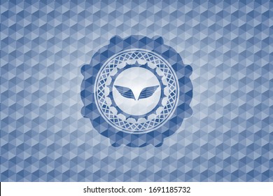 wings icon inside blue emblem or badge with geometric pattern background.