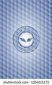 wings icon inside blue hexagon badge.