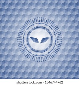 wings icon inside blue polygonal emblem.