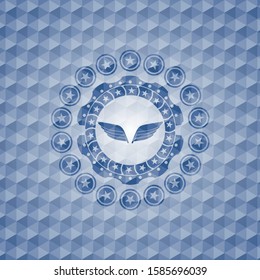 wings icon inside blue polygonal badge.