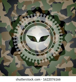 wings icon inside camouflage emblem