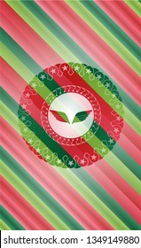 wings icon inside christmas badge.