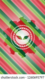 wings icon inside christmas colors style emblem.