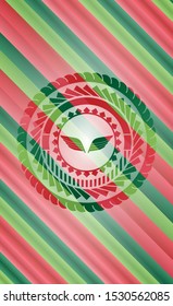 wings icon inside christmas style badge..