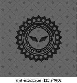 wings icon inside dark badge or emblem