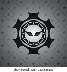 wings icon inside dark badge or emblem