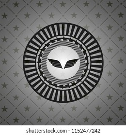wings icon inside dark emblem