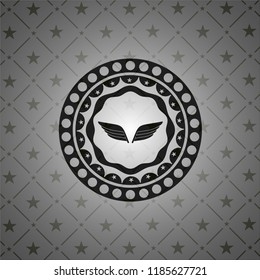 wings icon inside dark emblem. Retro
