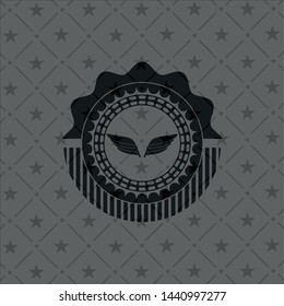 wings icon inside dark emblem. Retro