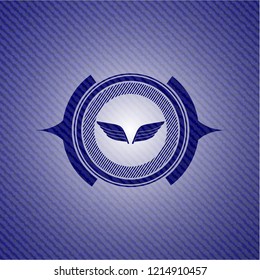 wings icon inside emblem with jean texture