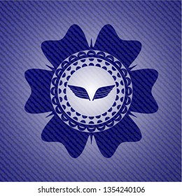 wings icon inside emblem with jean high quality background