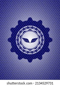 wings icon inside emblem with jean high quality background. 