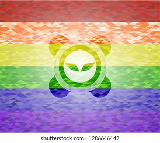 wings icon inside emblem on mosaic background with the colors of the LGBT flag