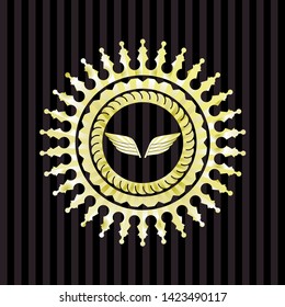 wings icon inside gold badge or emblem