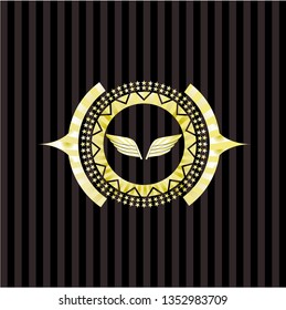 wings icon inside gold emblem