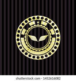wings icon inside gold emblem