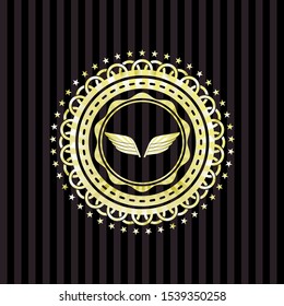 wings icon inside gold emblem or badge