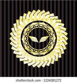 wings icon inside gold shiny emblem