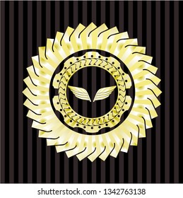 wings icon inside golden emblem