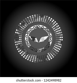 wings icon inside grey camo emblem