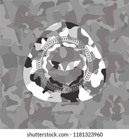 wings icon inside grey camouflage emblem