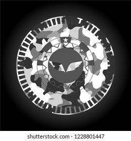 wings icon inside grey camouflaged emblem