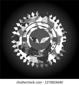 wings icon inside grey camouflaged emblem
