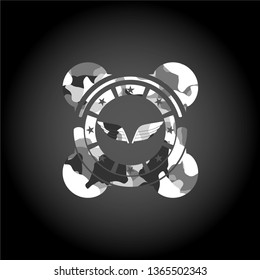 wings icon inside grey camouflaged emblem