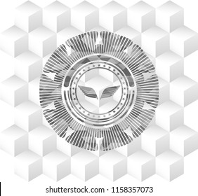 wings icon inside grey emblem with cube white background