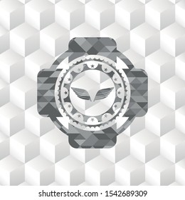 wings icon inside grey emblem with cube white background