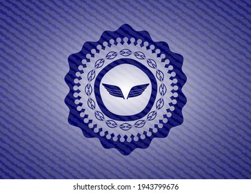 wings icon inside jean or denim emblem or badge background. 