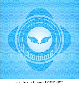 wings icon inside light blue water badge background.