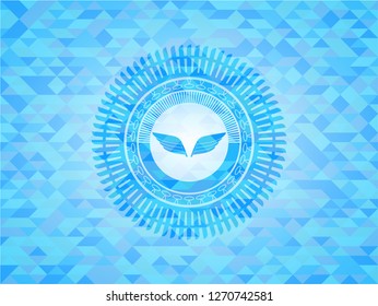 wings icon inside light blue mosaic emblem