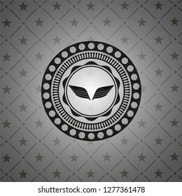 wings icon inside realistic black emblem