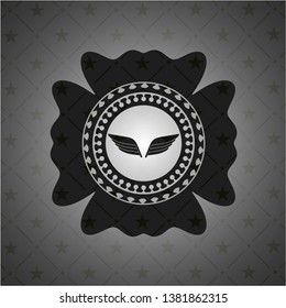 wings icon inside realistic black emblem