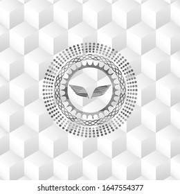 wings icon inside realistic grey emblem with cube white background