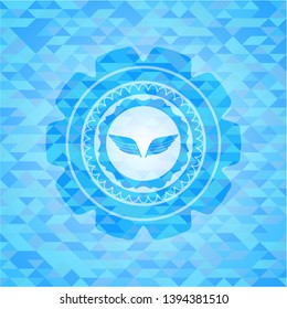 wings icon inside realistic sky blue mosaic emblem
