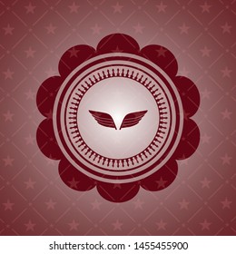wings icon inside red emblem