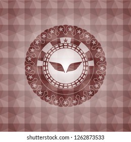 wings icon inside red seamless geometric badge.