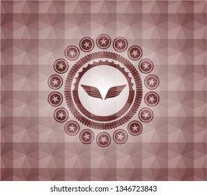 wings icon inside red seamless emblem with geometric pattern.