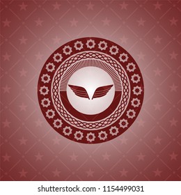 wings icon inside retro red emblem