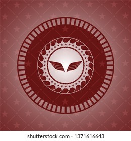 wings icon inside retro red emblem