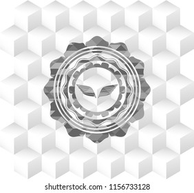 wings icon inside retro style grey emblem with geometric cube white background