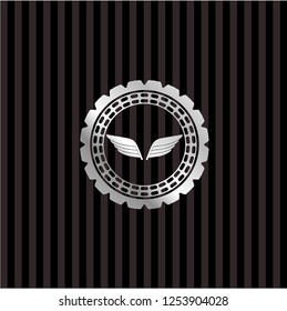 wings icon inside silver badge