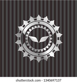 wings icon inside silver badge or emblem