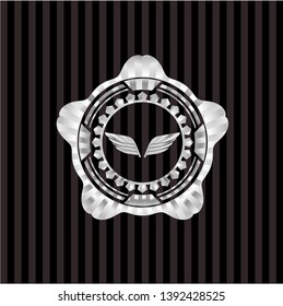 wings icon inside silver badge or emblem
