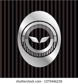 wings icon inside silver shiny emblem