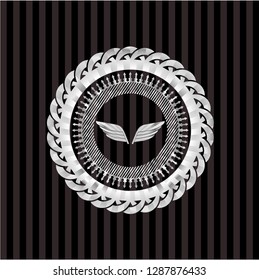 wings icon inside silvery badge