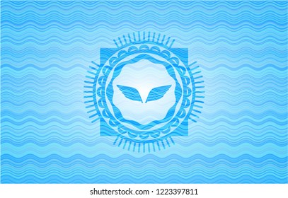 wings icon inside water representation emblem.