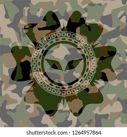 wings icon on camouflage pattern